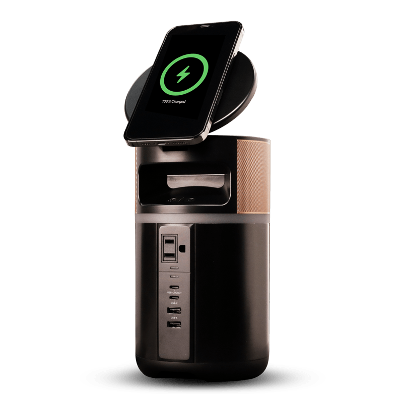 Image of the power station with a phone wirelessly charging on top and the lid tilted up.