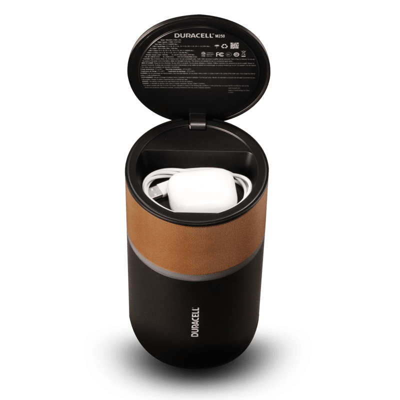 Image of the product with the lid up and cord storage compartment shown.