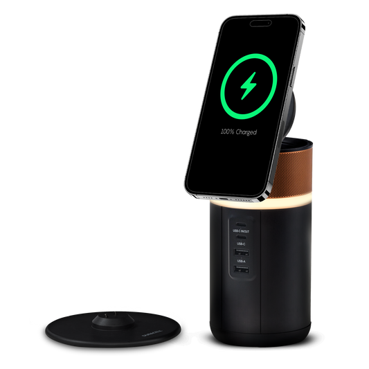 Duracell M150 charger with a phone wirelessly charging and the charging dock next to the charger