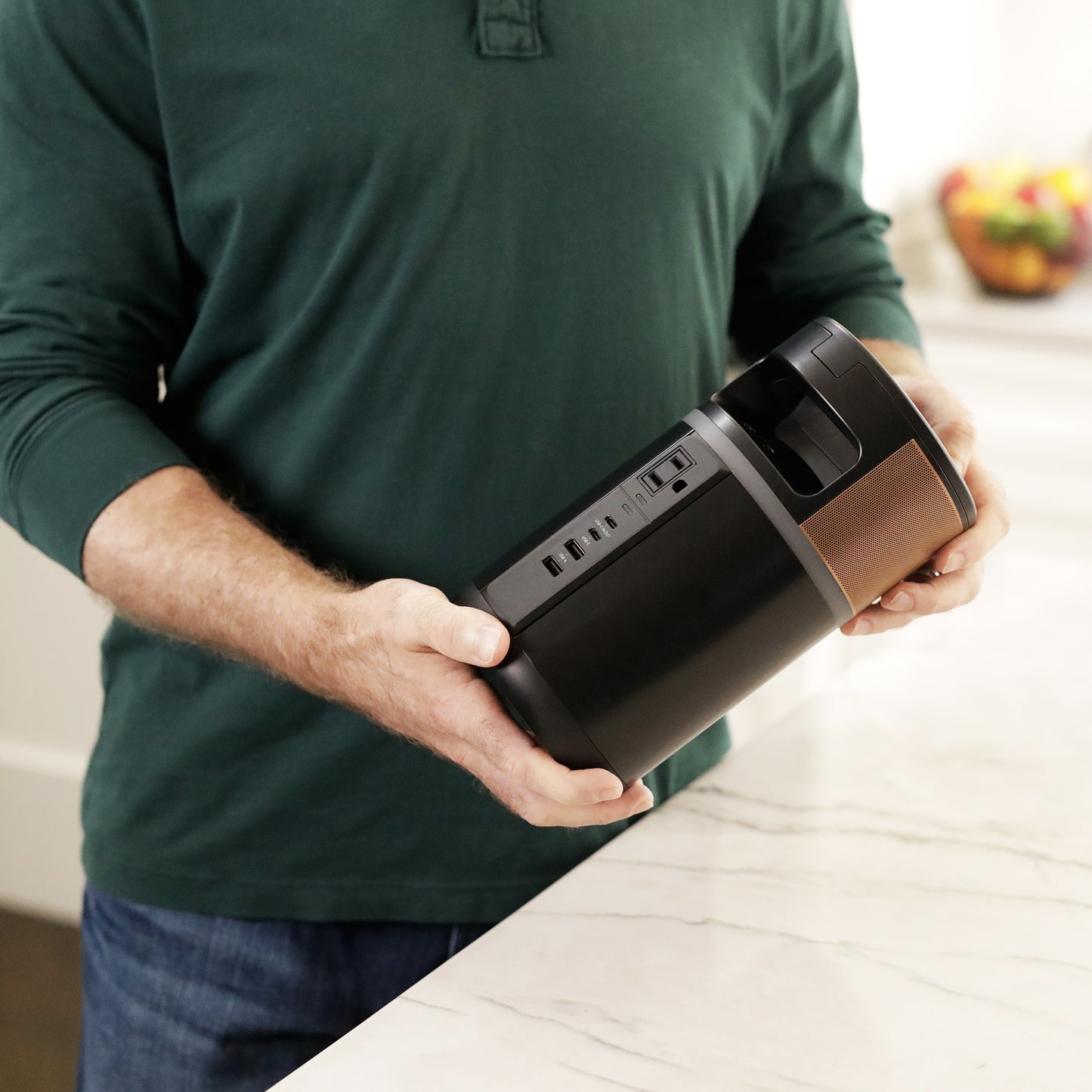 A man holding the charging hub in his hands