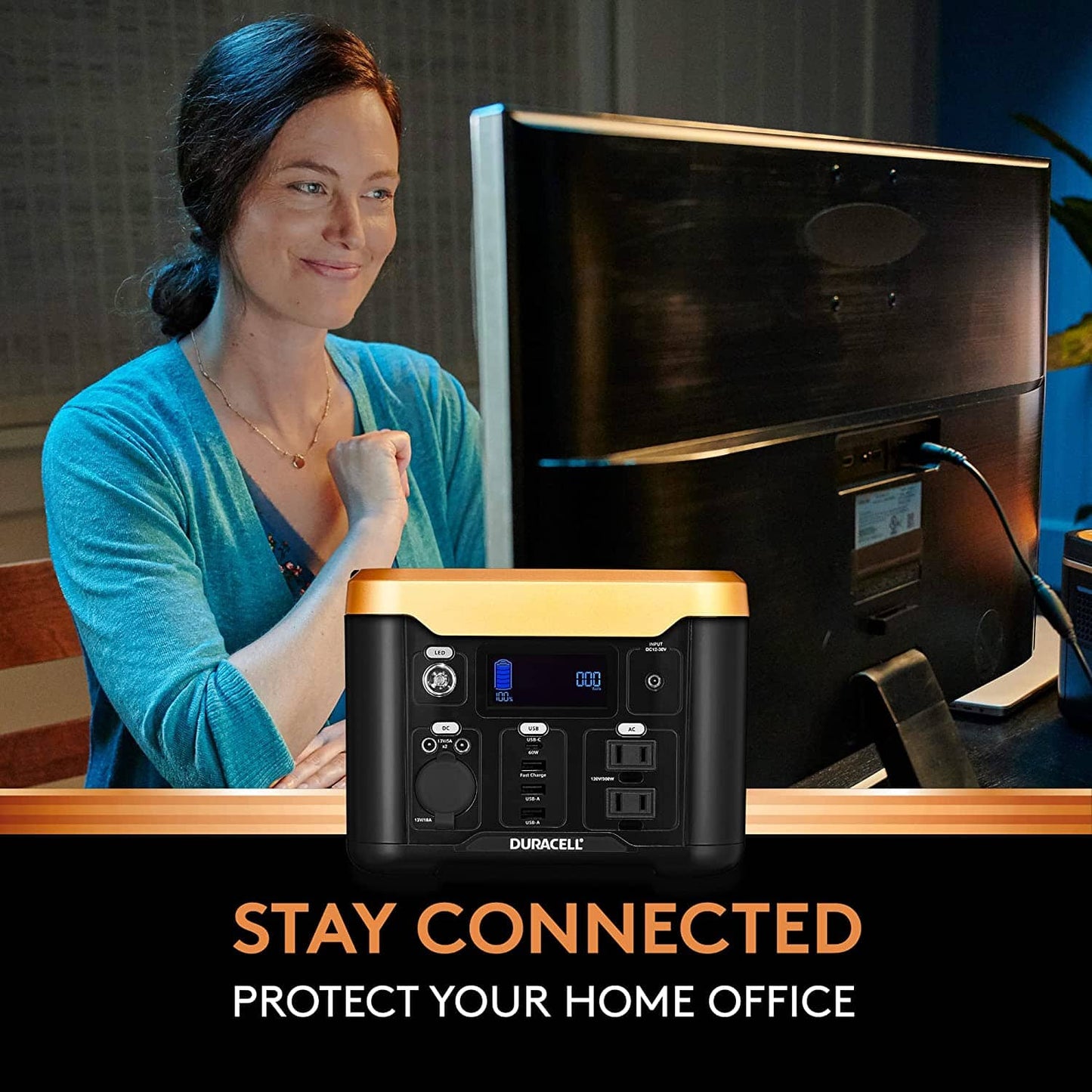 Image of a woman who is able to work on her computer in a power outage thanks to her power station.